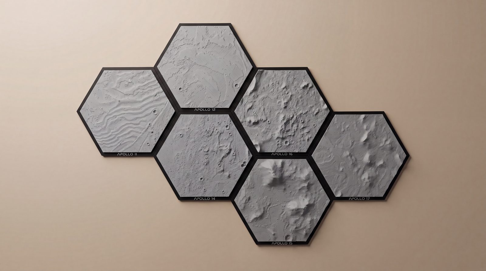 Six printed hexagon tiles of the Apollo 11, 12, 14, 15, 16 and 17 landing sites, arranged together on a wall